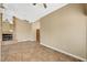 Inviting living room featuring a stone fireplace and tiled floors at 5401 Broadwater Ln, Las Vegas, NV 89130