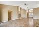 Spacious living room features tile floors, a fireplace, and a sliding door to the backyard at 5401 Broadwater Ln, Las Vegas, NV 89130
