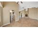 Open-concept living area with tile flooring, fireplace, and seamless flow to the kitchen at 5401 Broadwater Ln, Las Vegas, NV 89130