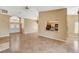 Open living room features tile flooring, a fireplace, and kitchen access at 5401 Broadwater Ln, Las Vegas, NV 89130