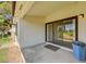 A covered patio leading to backyard, offering tranquil green lawn and lush landscaping at 5401 Broadwater Ln, Las Vegas, NV 89130