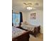 Cozy bedroom with twin beds, neutral carpet, and window at 5576 W Rochelle Ave # 27A, Las Vegas, NV 89103