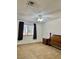 Bedroom with large window, neutral carpet, and minimal furniture at 5576 W Rochelle Ave # 27A, Las Vegas, NV 89103