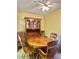 Charming dining area featuring a wood table set and antique cabinet with glass doors, perfect for Gathering meals at 5576 W Rochelle Ave # 27A, Las Vegas, NV 89103