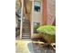 Exterior view of apartment stairs leading to the front door, adorned with verdant shrubbery and a manicured walkway at 5576 W Rochelle Ave # 27A, Las Vegas, NV 89103