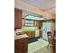 Traditional kitchen featuring wooden cabinets, white appliances, and ample lighting at 5576 W Rochelle Ave # 27A, Las Vegas, NV 89103