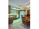 Traditional kitchen featuring wooden cabinets, white appliances, and ample lighting at 5576 W Rochelle Ave # 27A, Las Vegas, NV 89103