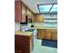Traditional kitchen featuring wooden cabinets and standard white appliances at 5576 W Rochelle Ave # 27A, Las Vegas, NV 89103