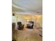 Bright living room featuring comfortable seating, warm lighting, and a welcoming atmosphere for gathering at 5576 W Rochelle Ave # 27A, Las Vegas, NV 89103