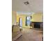 Spacious living room with fireplace and large windows, flowing seamlessly into dining area, perfect for gatherings at 5576 W Rochelle Ave # 27A, Las Vegas, NV 89103