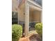 Private patio with metal railing offers outdoor seating and access to natural light, surrounded by green landscaping at 5576 W Rochelle Ave # 27A, Las Vegas, NV 89103