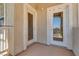 Cozy balcony space features two white doors and a concrete floor at 5855 Valley Dr # 2106, North Las Vegas, NV 89031