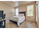Bedroom featuring wood-look floors, large windows, and neutral paint for a peaceful atmosphere at 5855 Valley Dr # 2106, North Las Vegas, NV 89031