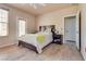 Inviting bedroom featuring wood-look floors, a ceiling fan, and access to a balcony at 5855 Valley Dr # 2106, North Las Vegas, NV 89031