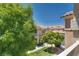 Scenic view from a balcony showcasing the well-manicured lawns and architecture of the community at 5855 Valley Dr # 2106, North Las Vegas, NV 89031