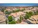 Attractive townhome features an attached garage, mature trees, and well-maintained landscaping at 5855 Valley Dr # 2106, North Las Vegas, NV 89031