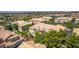 Eye-level aerial shot of a townhome with fresh landscaping, large windows, and a red-tiled roof at 5855 Valley Dr # 2106, North Las Vegas, NV 89031