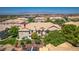 Up close shot of a beautiful townhome with manicured landscaping, tile roof, and a balcony at 5855 Valley Dr # 2106, North Las Vegas, NV 89031
