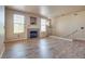 Bright living room with hardwood floors, fireplace, and staircase with white railings at 5855 Valley Dr # 2106, North Las Vegas, NV 89031