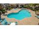 Community pool and jacuzzi area surrounded by ample seating and shade at 5855 Valley Dr # 2106, North Las Vegas, NV 89031