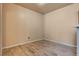 Clean, spare room with wood floors, and neutral paint, great for a small office or den at 5855 Valley Dr # 2106, North Las Vegas, NV 89031