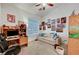 Bedroom featuring a window, desk and a light colored couch at 5933 Perfect View St, Las Vegas, NV 89130