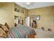 Spacious bedroom with neutral tones, natural light, closet and bathroom access at 5933 Perfect View St, Las Vegas, NV 89130