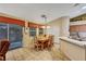 Bright dining area with tile floors, a ceiling fan, and a view of the patio at 5933 Perfect View St, Las Vegas, NV 89130