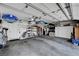 Spacious garage with ample storage space and high ceilings with shelving at 5933 Perfect View St, Las Vegas, NV 89130