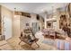 Open-concept living room showcasing high ceilings, tiled floors, comfortable seating, and adjacent dining area at 5933 Perfect View St, Las Vegas, NV 89130