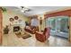 Inviting living room with a fireplace, comfortable seating, and natural light at 5933 Perfect View St, Las Vegas, NV 89130
