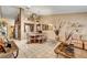 Spacious living room featuring tile flooring, comfortable sectional seating and view of the dining area at 5933 Perfect View St, Las Vegas, NV 89130