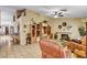 Cozy living room featuring tile floors, fireplace and custom built-in storage at 5933 Perfect View St, Las Vegas, NV 89130