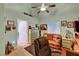 Office featuring a brown leather couch and chair, side table, and guitar on the floor at 5933 Perfect View St, Las Vegas, NV 89130