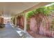Covered patio with lush plant accents and outdoor seating at 5933 Perfect View St, Las Vegas, NV 89130