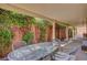 Covered patio framed by lush greenery at 5933 Perfect View St, Las Vegas, NV 89130
