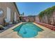 A refreshing swimming pool nestled in a private backyard surrounded by tasteful decorations at 5933 Perfect View St, Las Vegas, NV 89130