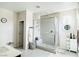 Contemporary bathroom features a glass-enclosed shower, modern tile, and ample storage at 6230 Bravestar Ct, Las Vegas, NV 89141