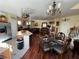 Open dining and living area showcasing elegant decor, chandelier, and stainless steel appliances at 6329 Kitamaya St, North Las Vegas, NV 89031
