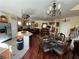Open dining and living area showcasing elegant decor, chandelier, and stainless steel appliances at 6329 Kitamaya St, North Las Vegas, NV 89031