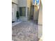 Welcoming entrance featuring decorative plants and stylish stone accents enhance the curb appeal at 6329 Kitamaya St, North Las Vegas, NV 89031