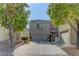 Charming two-story home featuring a two-car garage, well-maintained landscaping, and a welcoming entrance at 6329 Kitamaya St, North Las Vegas, NV 89031