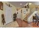 Inviting foyer with staircase, decorative accents, and hardwood floors welcomes you into this beautiful home at 6329 Kitamaya St, North Las Vegas, NV 89031