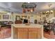 Open kitchen and living area featuring an island and hardwood floors at 6329 Kitamaya St, North Las Vegas, NV 89031
