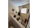 Stairway landing showcasing a decorative shelf, plants and window at 6329 Kitamaya St, North Las Vegas, NV 89031
