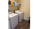 Compact laundry room with a side-by-side washer and dryer at 6329 Kitamaya St, North Las Vegas, NV 89031