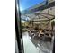 Charming outdoor patio featuring a shaded gazebo with comfortable seating and lush landscaping at 6329 Kitamaya St, North Las Vegas, NV 89031
