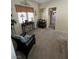 Sitting room with a cozy chair and dark wood furniture at 6329 Kitamaya St, North Las Vegas, NV 89031