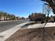 Street view with sidewalk and desert landscaping at 6329 Kitamaya St, North Las Vegas, NV 89031