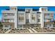Modern townhouse exterior featuring multiple levels, clean lines, and contemporary design at 650 Agate Bridge St, Las Vegas, NV 89138